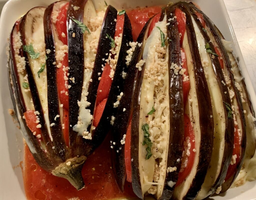 Inserting ingredients betweens slices of eggplant