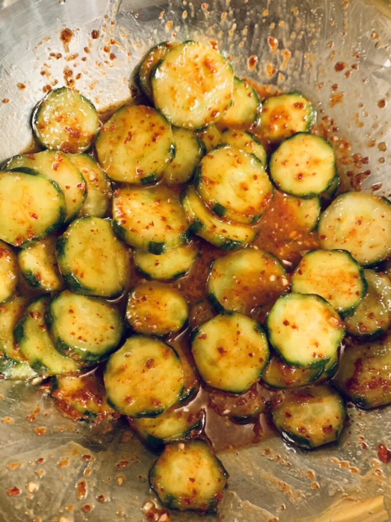 Cucumber slices tossed in prepared dressing