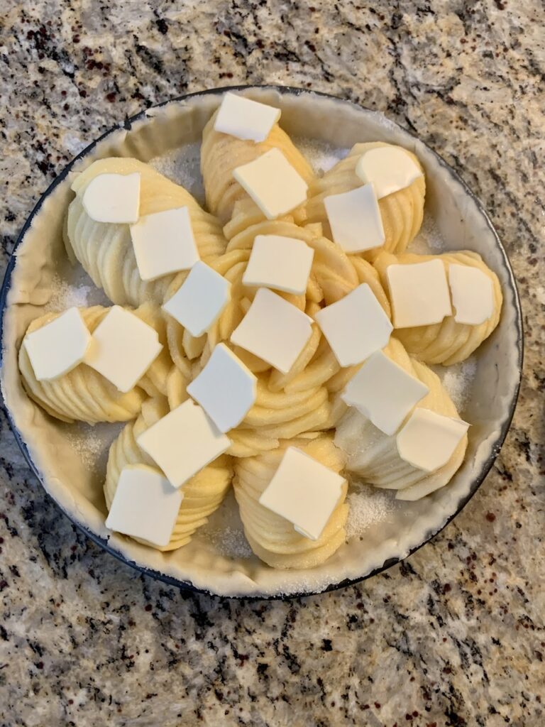 Fun French Apple Tart: Sprinkle with sugar and top with butter slices