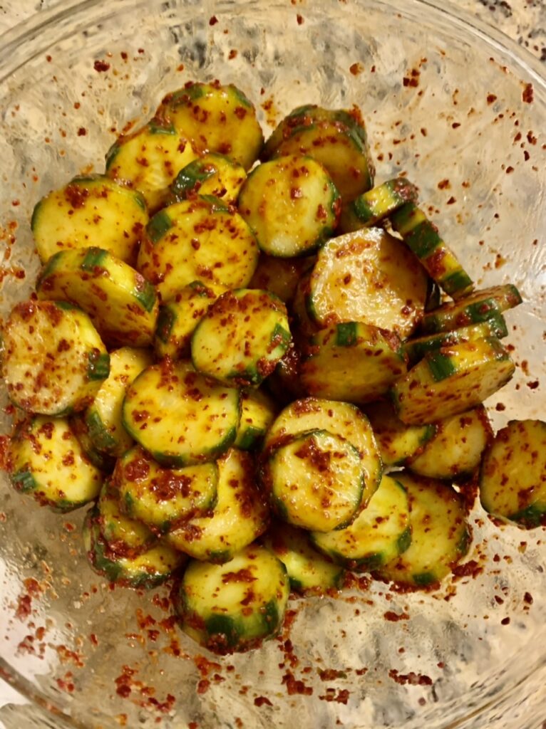 Cucumber slices seasoned with coarse chilli flakes, salt and sugar