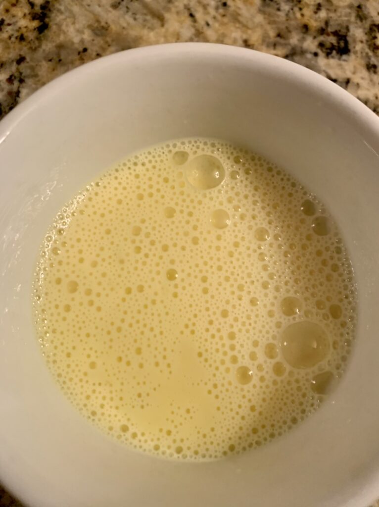 Making the egg glaze for Sticky Braided Cinnamon Knots