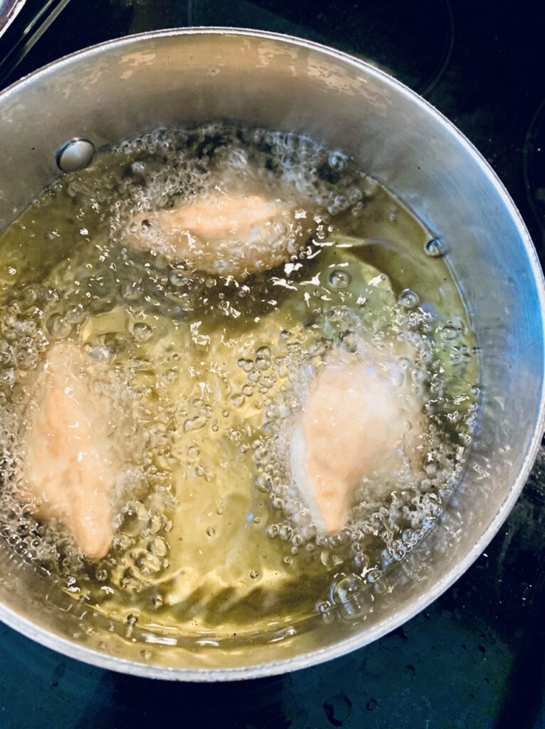 Deep frying the Spicy Potato Samosas