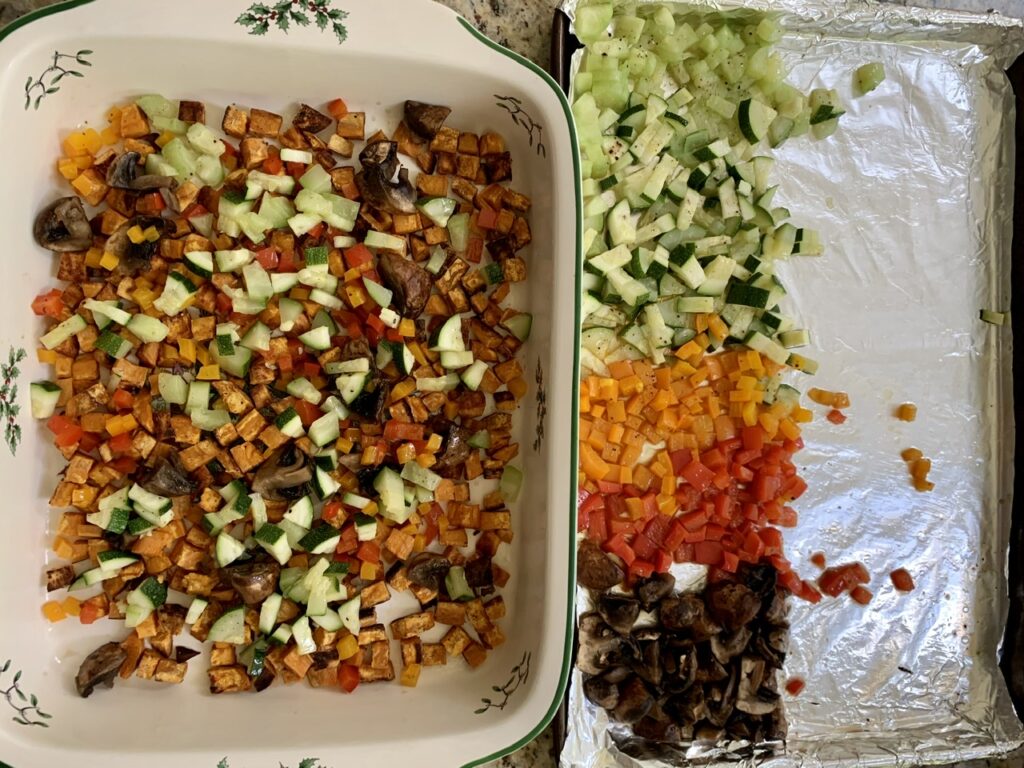 Spread out the roasted veggies evenly on the baking dish