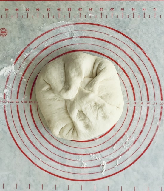 Tip dough onto work surface 