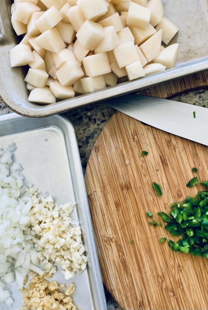 Preparing filling for Spicy Potato Samosas