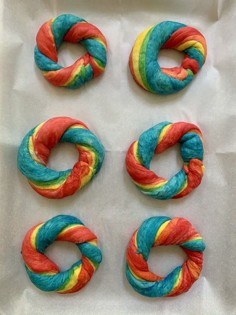 Placed shaped bagels on parchment lined pan