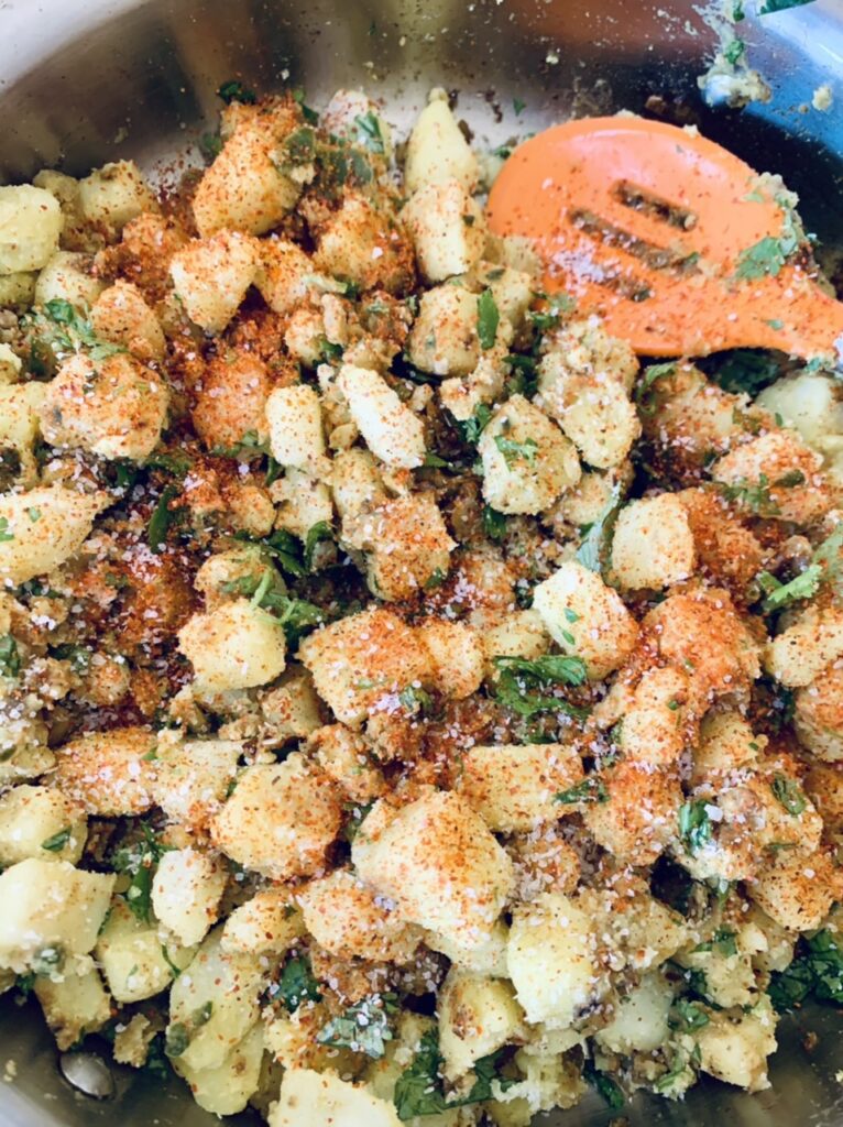 Preparing filling for Spicy Potato Samosas