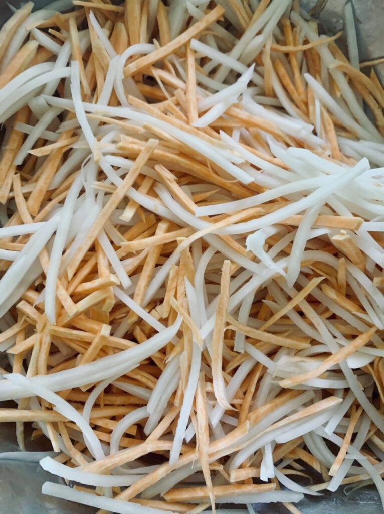 Mixing the matchstick potatoes